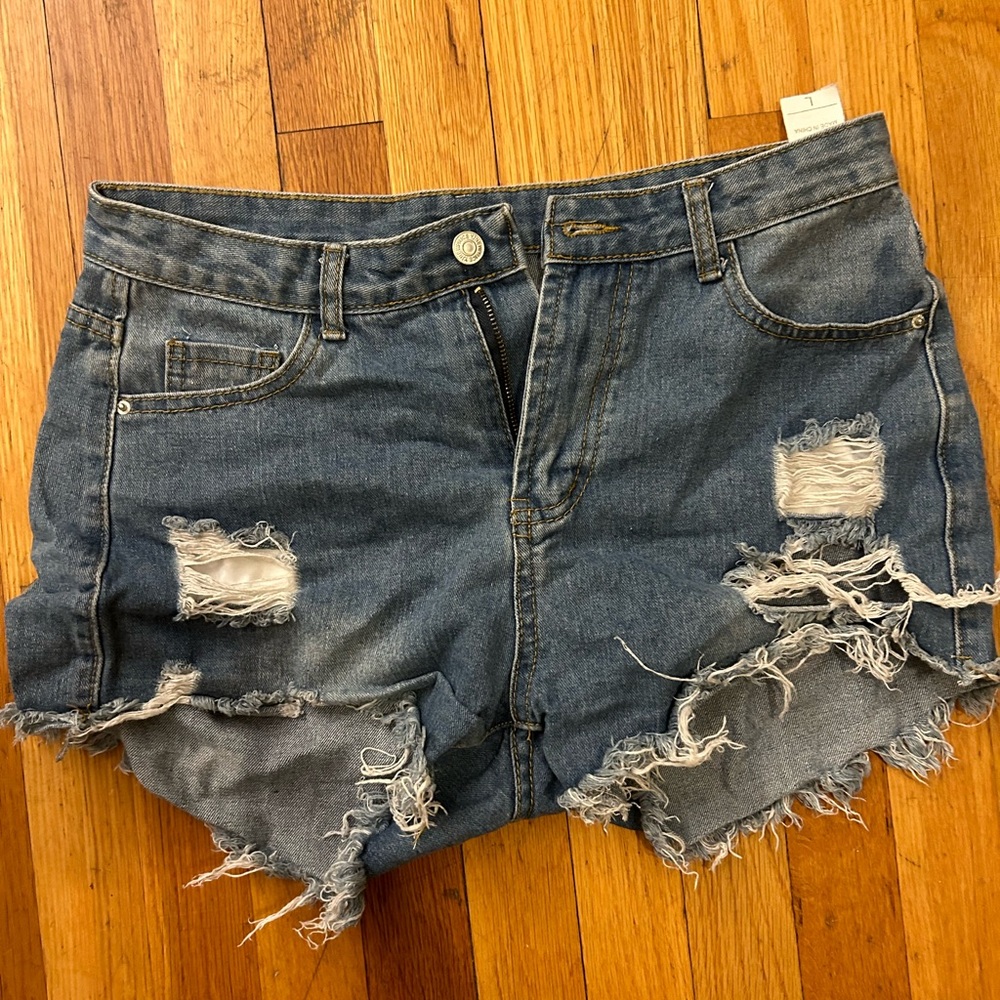 Denim distressed shorts. RUNS SMALL